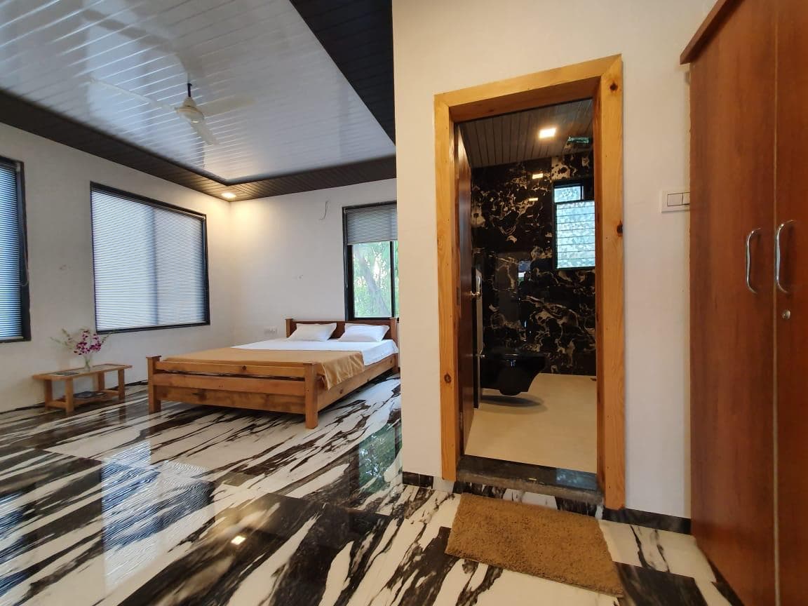 Elegant bedroom with natural lighting at LakesideMantra